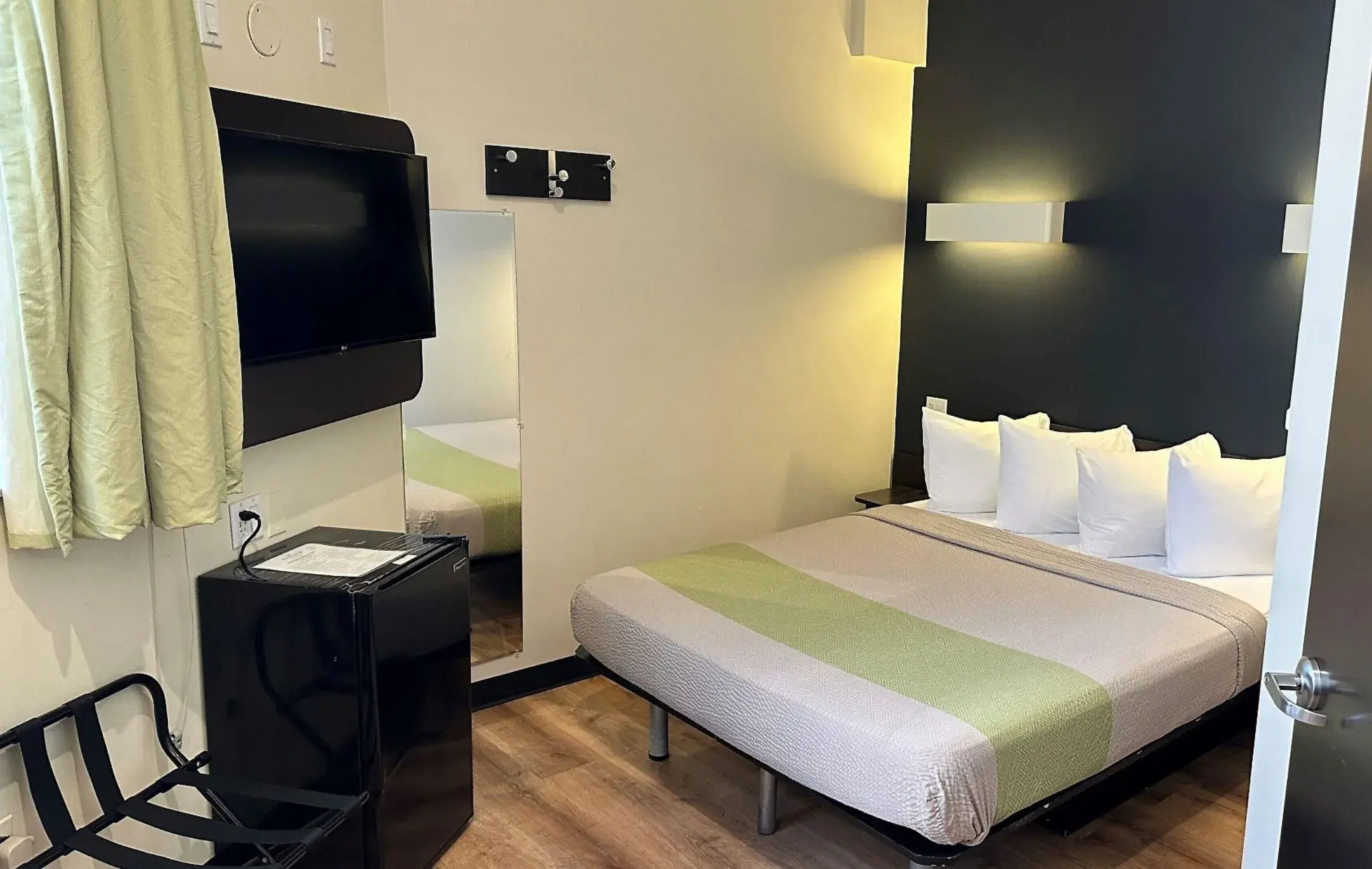 Standard Double Room with a double bed, mini-fridge, full-length mirror and luggage rack